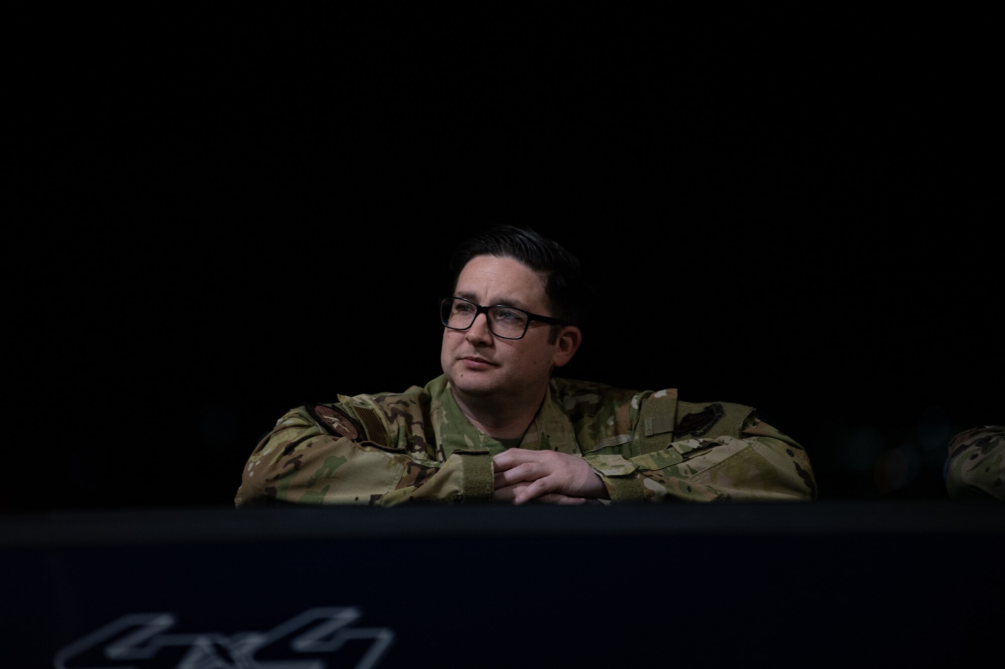 U.S. Air Force Master Sgt. Ben Kirchner, 71st Rescue Squadron loadmaster superintendent, leans on a truck during Exercise Ready Tiger 24-1 at Savannah Air National Guard Base, Georgia, April 13, 2024. During Ready Tiger 24-1, exercise inspectors will assess the 23rd Wing's proficiency in employing decentralized command and control to fulfill air tasking orders across geographically dispersed areas amid communication challenges, integrating Agile Combat Employment principles such as integrated combat turns, forward aerial refueling points, multi-capable Airmen, and combat search and rescue capabilities. (U.S. Air Force photo by Senior Airman Courtney Sebastianelli)