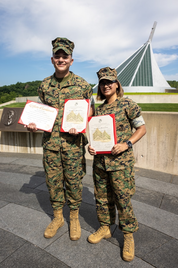 U.S. Marine Corps Sgt. Wilson MenaGarcia, a special meals noncommissioned officer in charge with base food service, left, and Sgt. Kelly MenaGarcia, a personnel noncommissioned officer in charge with Security Battalion, right, take a group photo after their promotion ceremony to sergeant at The National Museum of the Marine Corps, Triangle, Virginia, July 5, 2023. Promotion ceremonies are a significant achievement in a service member’s career and are a testament to their commitment, mastery of duties and skills, and leadership capabilities. Marines take on greater responsibilities as Non-Commissioned Officers after showing exemplary leadership skills.