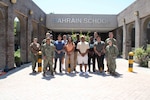 Sailors assigned to Naval Support Activity (NSA) Bahrain pose for a photo following a volunteer event at the Bahrain School, April 23, 2024. The volunteers assisted in reestablishing suitable classroom spaces for students to return from a virtual learning environment. NSA Bahrain enables the forward operations and responsiveness of U.S. and allied forces in support of the Navy Region Europe, Africa, Central mission to provide services to the fleet, warfighter and family.