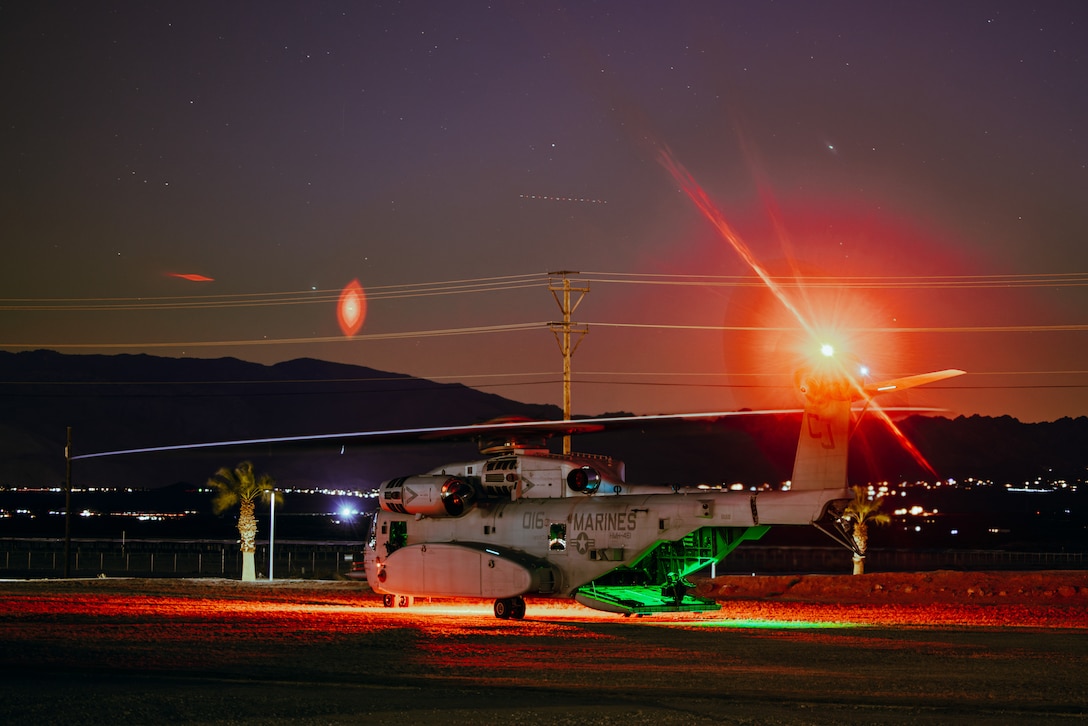 A U.S. Marine Corps CH-53K King Stallion assigned to Marine Aviation Weapons and Tactics Squadron One prepares to take off during a Noncombatant Evacuation Operation exercise as part of Weapons and Tactics Instructor Course 2-24 at Marine Corps Air-Ground Combat Center, Twentynine Palms, California, April 12, 2024. The NEO, provided by MAWTS-1, gives students the opportunity to execute scenario-based training as part of their certification and preparation for real-world incidents that require a quick reaction force to extract personnel from hostile situations.  (U.S. Marine Corps photo by Lance Cpl. Richard PerezGarcia)