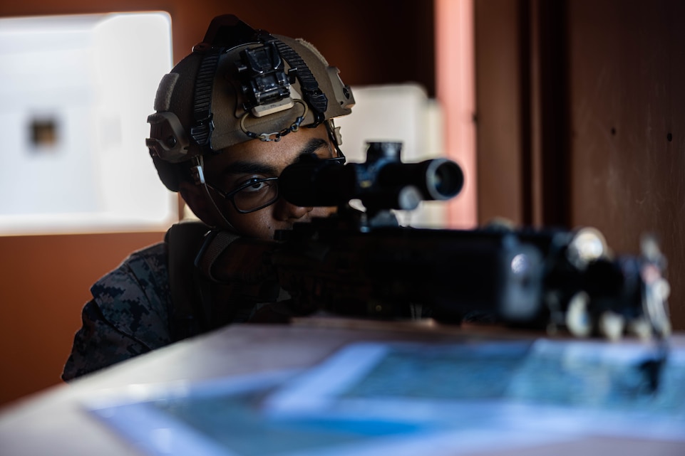 U.S. Marine Corps Lance Cpl. John Romero, a Pompano Beach, Florida native, infantry Marine with 2nd Battalion, 6th Marine Regiment, 2nd Marine Division, provides security with an M27 automatic rifle.