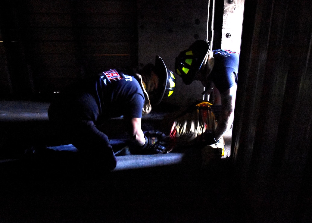 Fire fighters from Naval Air Station Whiting Field conduct a Search and Rescue training exercise.
