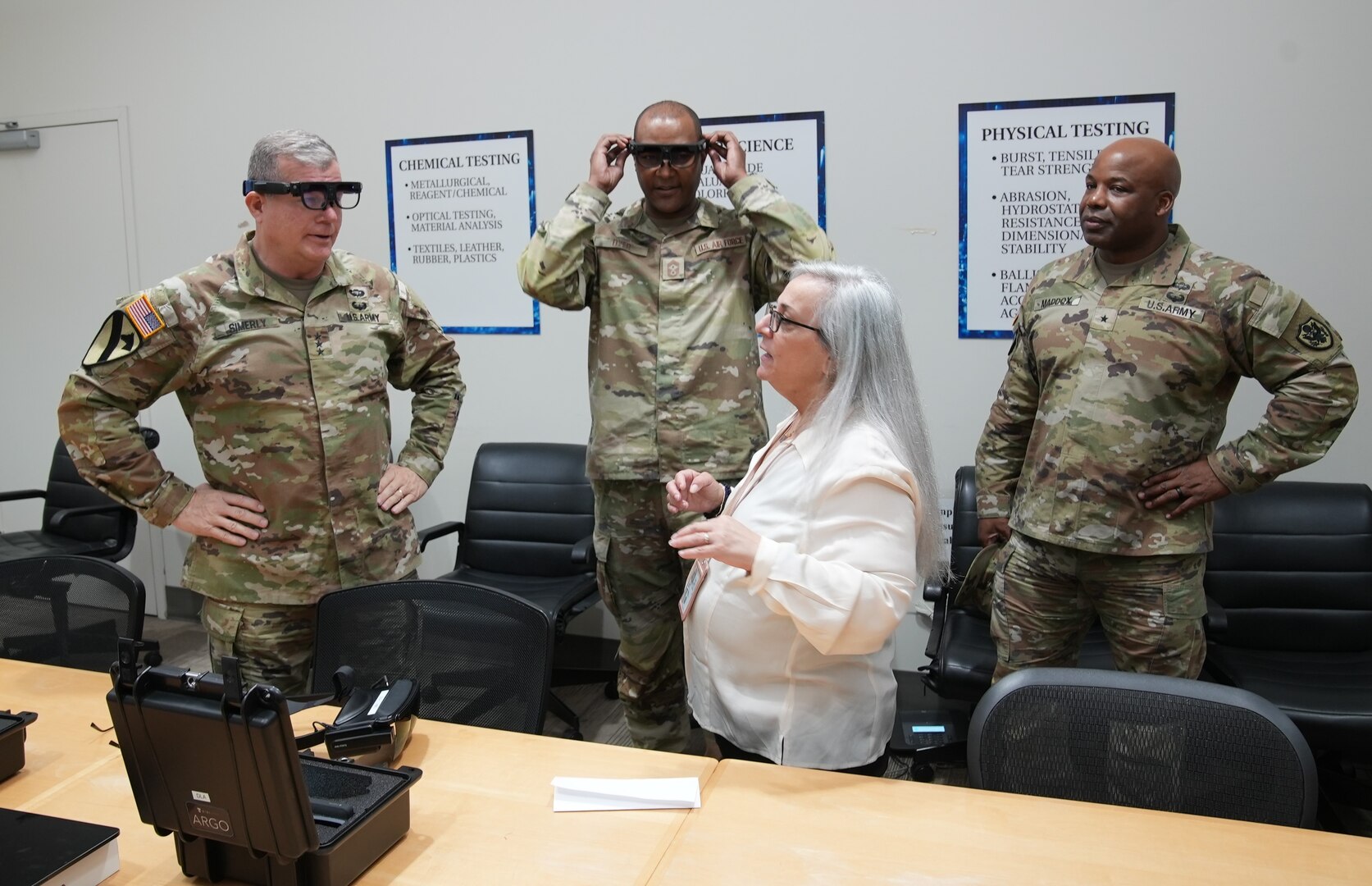 Army Lt. Gen. Mark Simerly, DLA director, and Air Force Command Chief Master Sgt. Alvin Dyer, DLA senior enlisted leader, try on the Product Test Center Analytical’ s latest augmented reality headsets April 18 during a visit to DLA Troop Support in Philadelphia. PTC laboratory staff use the goggles to remotely test materials at off-site locations.