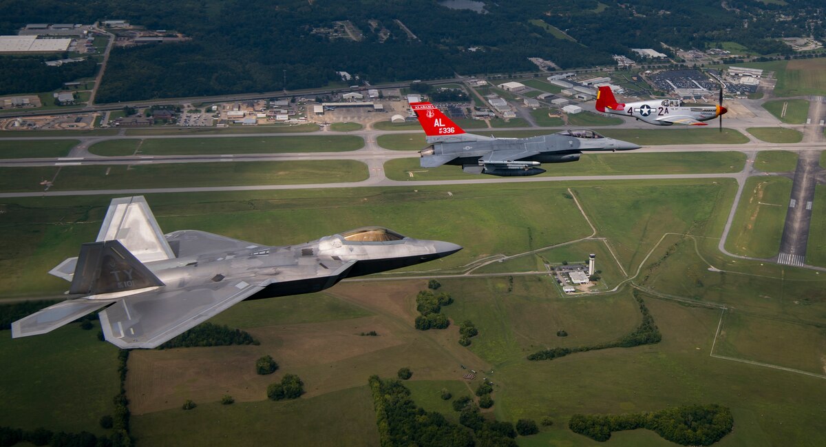 A U.S. Air Force F-22 Raptor, F-16 Fighting Falcon and a Commemorative Air Force P-51 Mustang fly in formation Sep. 6, 2018