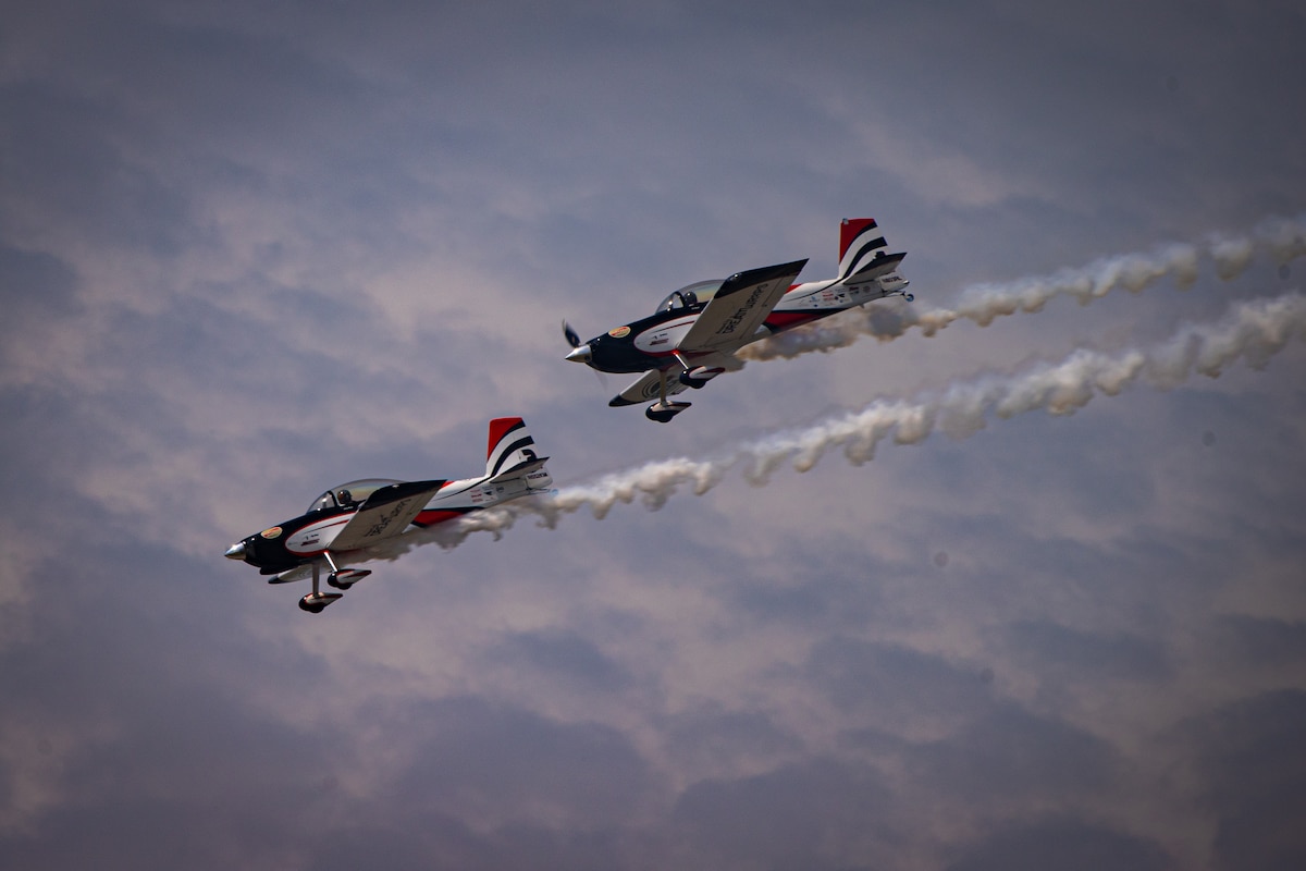 Smoke streams from two stunt planes
