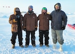 BEAUFORT SEA, Arctic Circle – (March 21, 2024) – Left to right:  Marcus Caldera, Justin Bequette, Andres Martinez Murillo, and Dr. William D’Angelo assigned to Naval Medical Research Unit (NAMRU) San Antonio’s Biomedical Systems Engineering and Evaluation Department, participated in Operation Ice Camp (ICE CAMP) 2024. ICE CAMP is a three-week operation that allows the Navy to assess its operational readiness in the Arctic, increase experience in the region, advance understanding of the Arctic environment, and continue to develop relationships with other services, allies, and partner organizations. NAMRU San Antonio’s mission is to conduct gap driven combat casualty care, craniofacial, and directed energy research to improve survival, operational readiness, and safety of Department of Defense (DoD) personnel engaged in routine and expeditionary operations. It is one of the leading research and development laboratories for the U.S. Navy under the DoD and is one of eight subordinate research commands in the global network of laboratories operating under the Naval Medical Research Command in Silver Spring, Md. (U.S. Navy Photo)
