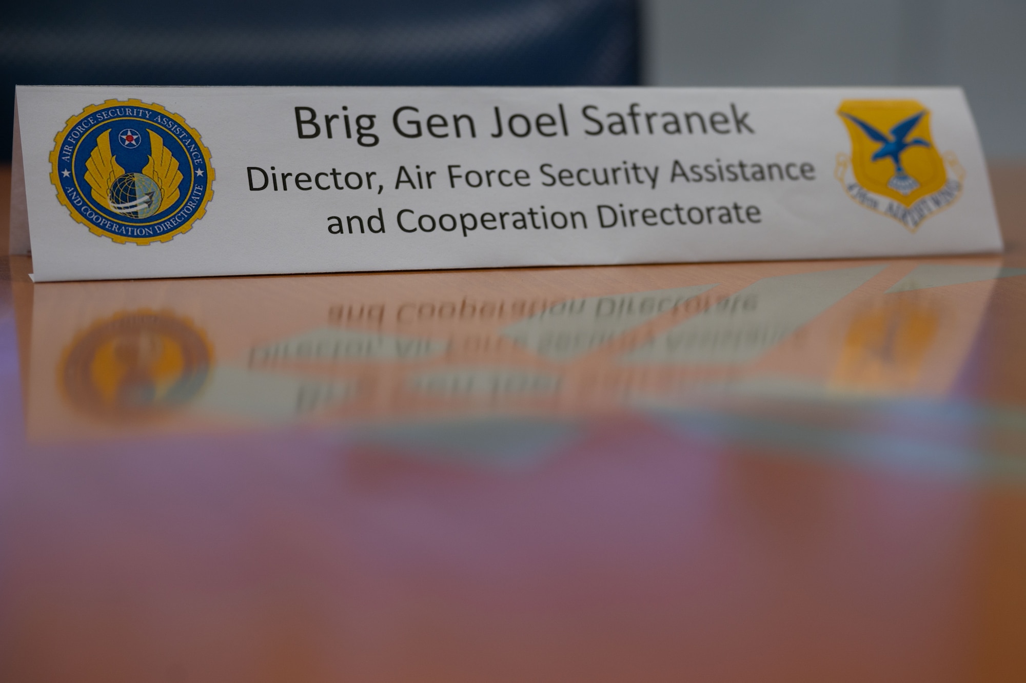 A name tag sits on a table during a Foreign Liaison Officer visit at Dover Air Force Base, Delaware, April 23, 2024. This visit gave the Foreign Liaison Officers a chance to learn about Dover AFB's ongoing mission of rapid global mobility, and their nation’s role in foreign military sales missions. (U.S. Air Force photo by Airman 1st Class Dieondiere Jefferies)