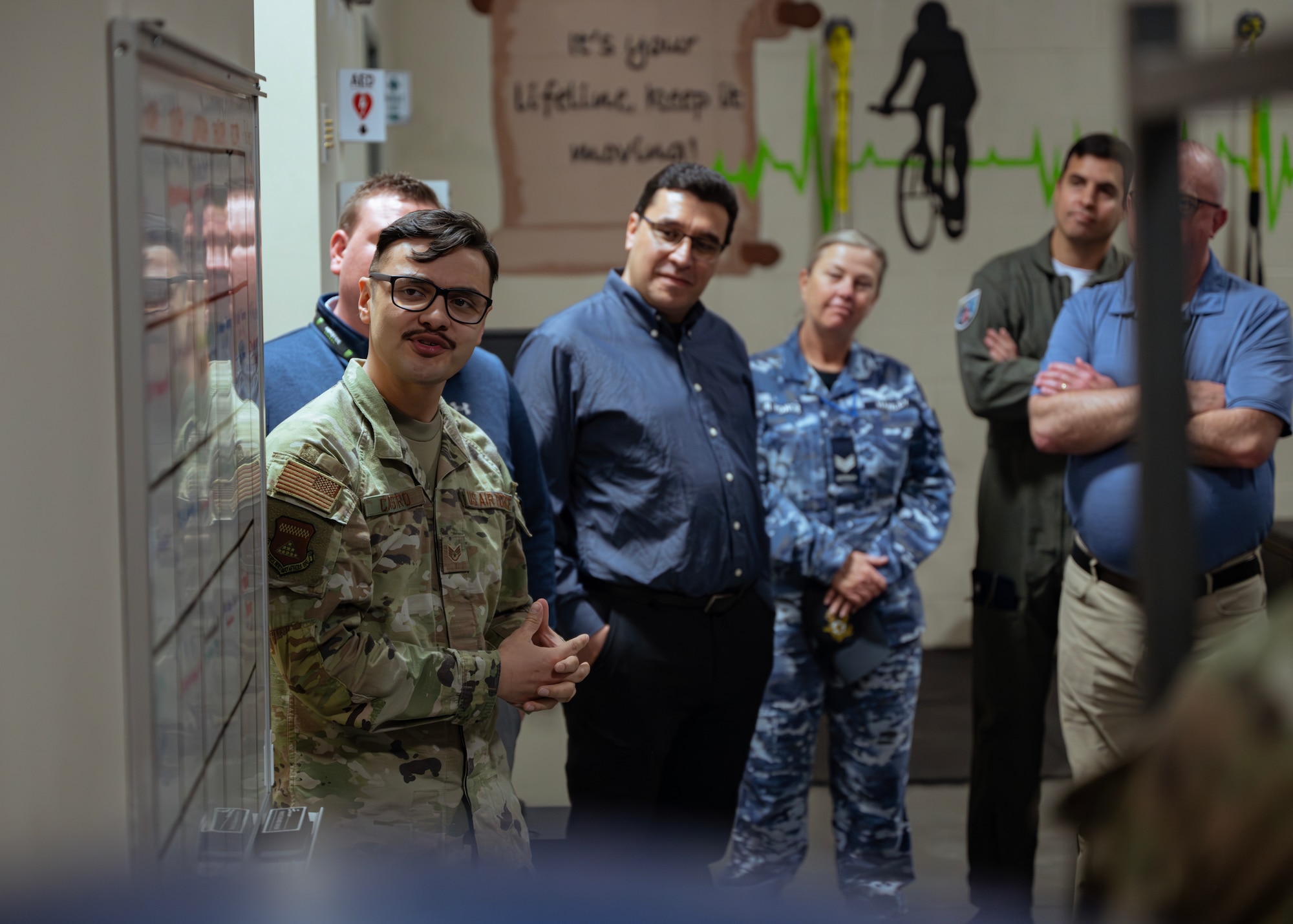 U.S. Air Force Staff Sgt. Ricardo Castro, Air Force Mortuary Affairs Operations mental health technician, briefs a team of Foreign Liaison Officers at Dover Air Force Base, Delaware, April 24, 2024. This visit gave the Foreign Liaison Officers a chance to learn about AFMAO’s role in honoring our fallen. (U.S. Air Force photo by Staff Sgt. Jayden Ford)