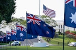 New Zealand and Australian flags on display during an Australia New Zealand Army Corps Day commemoration event at the National Memorial Cemetery of the Pacific in Honolulu, April 25. Anzac Day marks the anniversary of the first major military action fought by Australian and New Zealand forces during World War I. (U.S. Navy photo by Mass Communication Specialist 1st Class John Bellino)