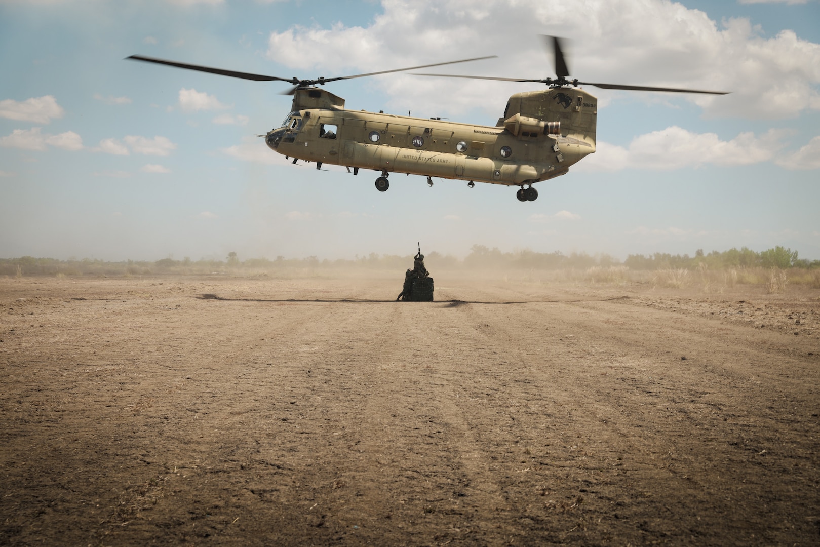 U.S. Army Soldiers assigned to the 25th Infantry Division Sustainment Brigade, 25th Infantry Division alongside Philippine Army Soldiers assigned to 7th Service Support Battalion, Army Support Command, and Special Forces Regiment Airborne conduct sling load training using A22 cargo bags with a CH-47 Chinook helicopter from the 25th Combat Aviation Brigade, 25th Infantry Division in support of Exercise Balikatan 24 at Fort Magsaysay, Philippines, April 22, 2024. BK 24 is an annual exercise between the Armed Forces of the Philippines and the U.S. military designed to strengthen bilateral interoperability, capabilities, trust, and cooperation built over decades of shared experiences. (U.S. Army Photo by Spc. Kai Rodriguez, 28th Public Affairs Detachment)