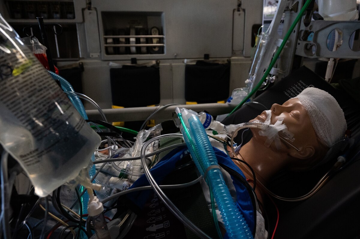 A simulated patient receives treatment on a C-17 Globemaster III on Joint Base Pearl Harbor-Hickam, Hawaii, April 10, 2024. Fifteen medical professionals from the island of Oahu visited Joint Base Pearl Harbor-Hickam to get eyes on the U.S. Air Force’s aeromedical evacuation system and its capabilities. (U.S. Air Force photo by Tech. Sgt. Hailey Haux)