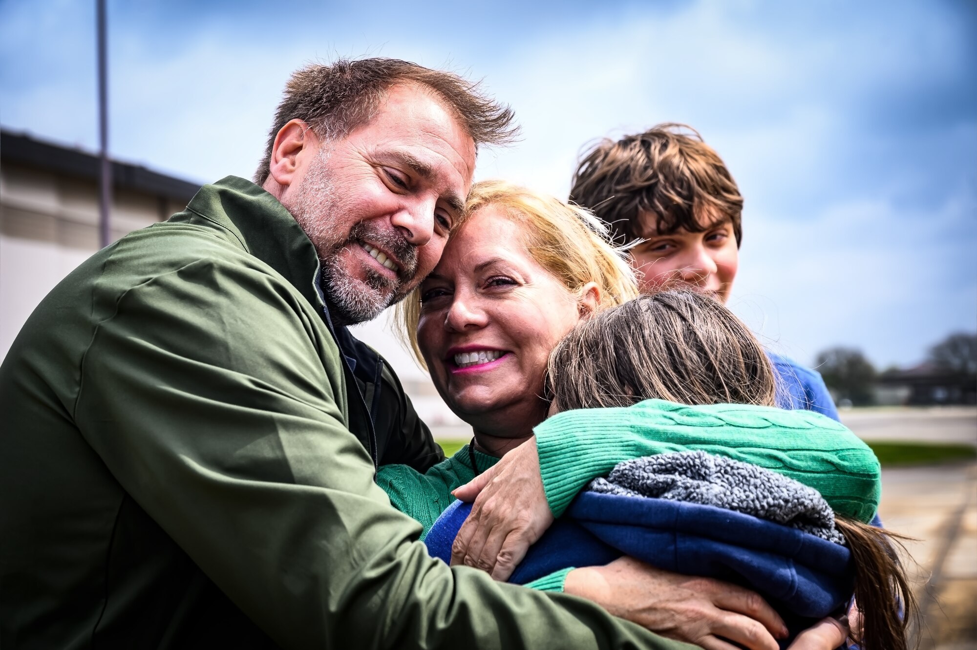 Local civilians embrace on a flight line at Joint Base McGuire-Dix-Lakehurst, N.J., April 20, 2024. The Mid-Air Collision Avoidance program is designed to ensure safety practices are observed between military and civilian pilots who share a common airspace. (U.S. Air Force photo by Senior Airman Matt Porter)