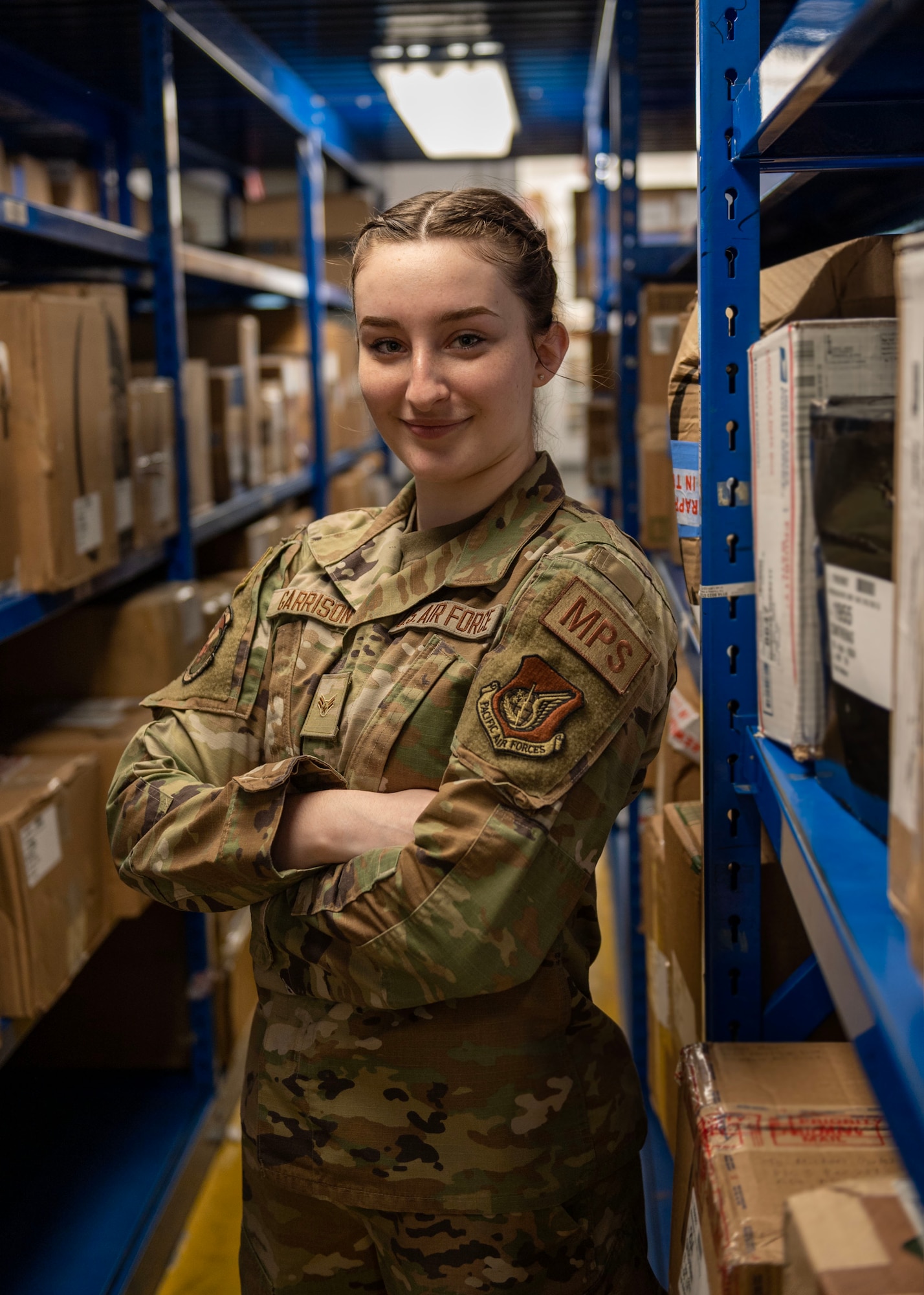 U.S. Air Force Airman 1st Class Brooke Garrison, 51st Force Support Squadron military postal clerk, poses for a portrait at Osan Air Base, Republic of Korea, April 19, 2024. Postal clerks handle all incoming and outgoing mail, which includes organizing letters, parcels and packages. Garrison earned Mustang of the Week, a title given to individuals who show exemplary effort, skill and knowledge within the 51st Fighter Wing. (U.S. Air Force photo by Staff Sgt. Aubree Owens)