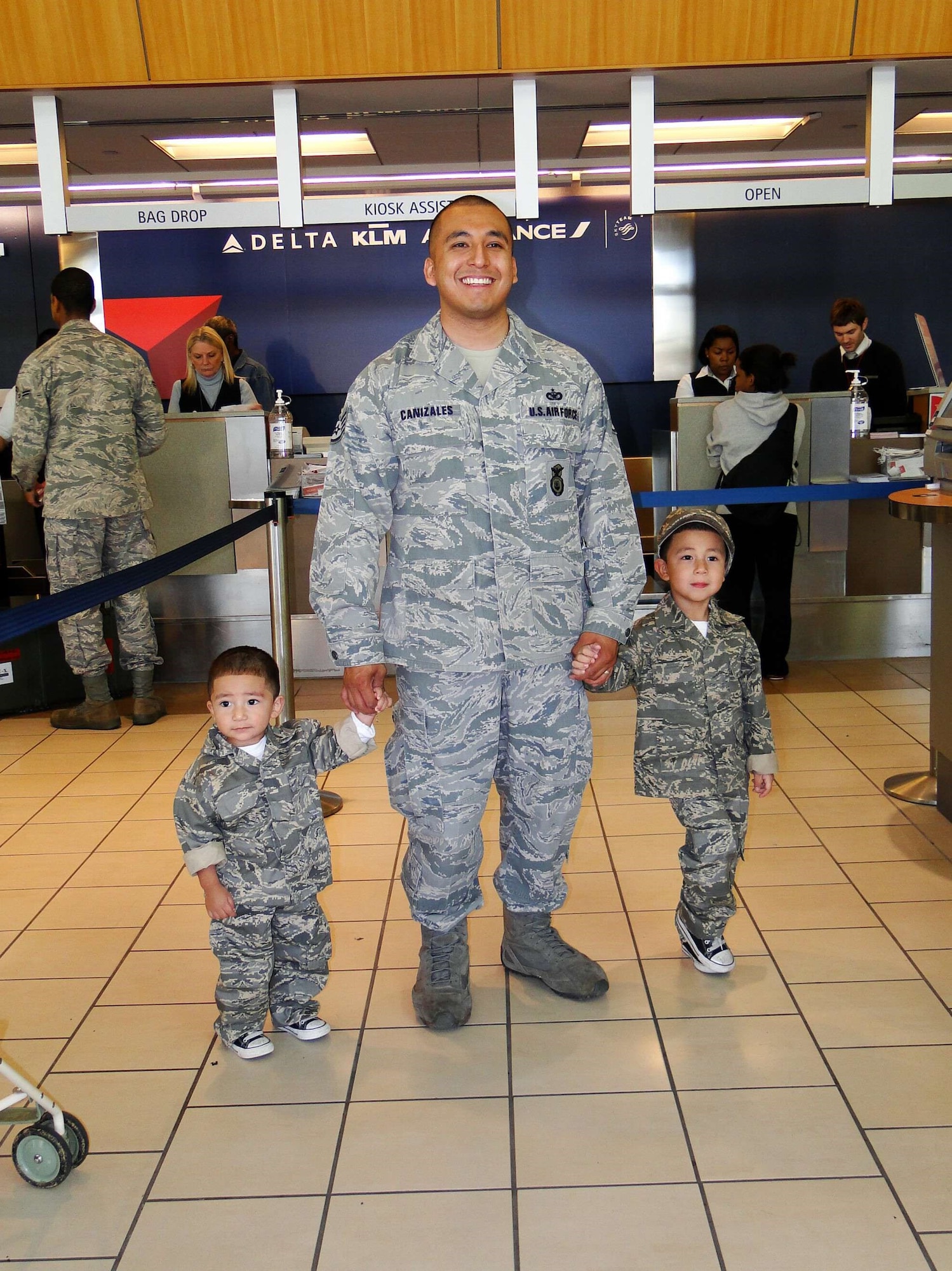U.S. Air Force Master Sgt. Justin Canizales, 51st Security Forces Squadron plans and programs superintendent, and his children Anthony and Ayden, pose for a photo in 2012. Canizales left for his second deployment while becoming a new father of two. Month of the Military Child annually recognizes the challenges and sacrifices of military children, while highlighting their resilience and dedication. (U.S. Air Force courtesy photo)