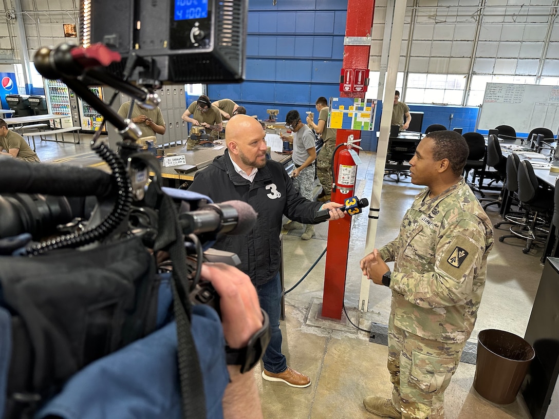 WTKR, News 3, military beat journalist Blaine Stewart interviews Army Capt. Andrew Lightsey, IV, 128th Aviation Brigade, Charlie Company 2-210 company commander, about the particulars of the 128th advanced individual training mission set. Stewart came out to JBLE-Eustis, visiting the 128th Aviation Brigade AIT schoolhouse, for WTKR News 3’s ‘Squadron of the Month’ April 2024! He spoke with 128th soldiers, leadership and AIT students, for a closer look at Army’s home of aviation maintenance. (U.S. Air Force photo by Erik Siegel)