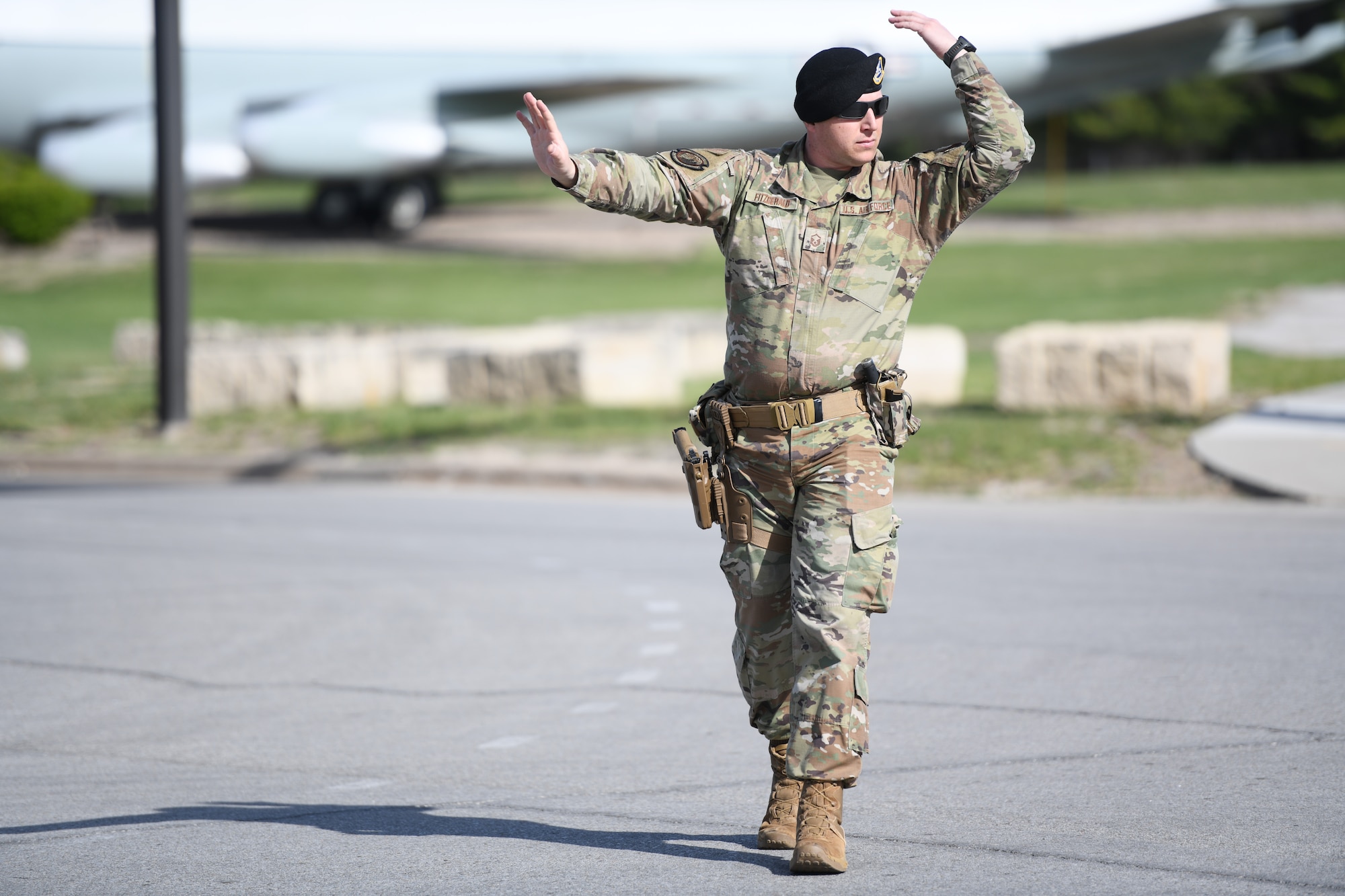 Airmen directs traffic during an energy resiliency readiness exercise.