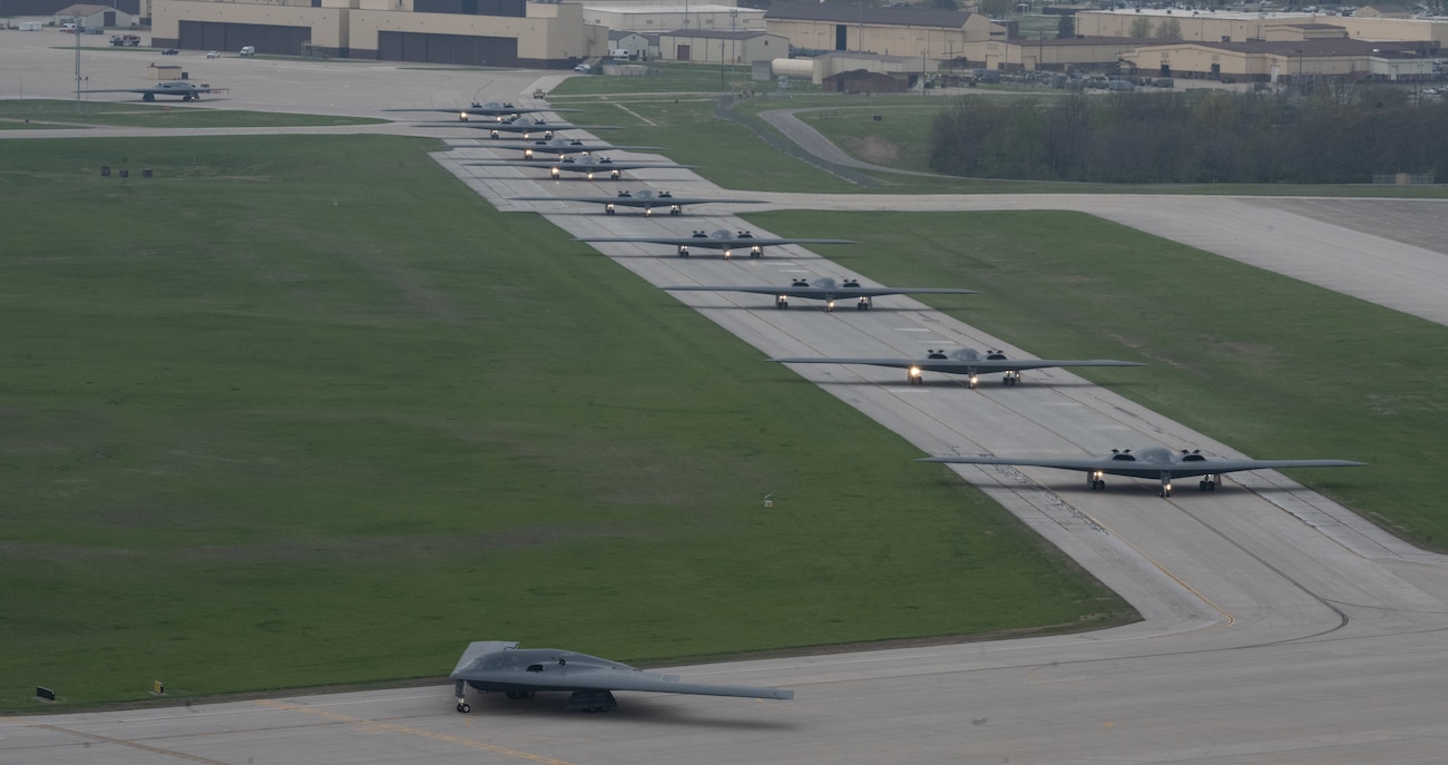B-2 Spirit stealth bombers assigned to the 509th Bomb Wing taxi on the runway