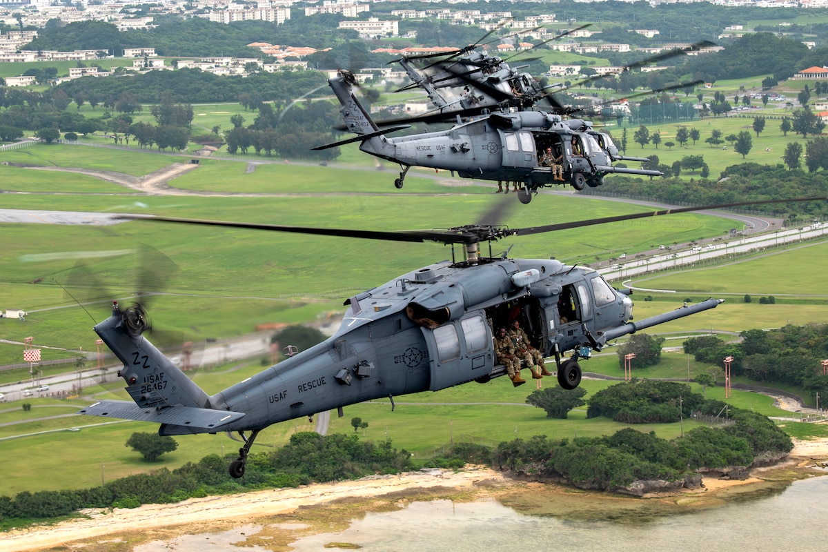 U.S. Air Force HH-60G Pave Hawks assigned to the 33rd Rescue Squadron fly in formation over Kadena Air Base, Japan, April 16, 2024. The Pave Hawk is a highly modified version of the Army Black Hawk helicopter which features upgraded communications and navigation suite along with automatic flight control system, night vision goggles, color weather radar and an engine/rotor blade anti-ice system. (U.S. Air Force photo by Staff Sgt. Jessi Roth)