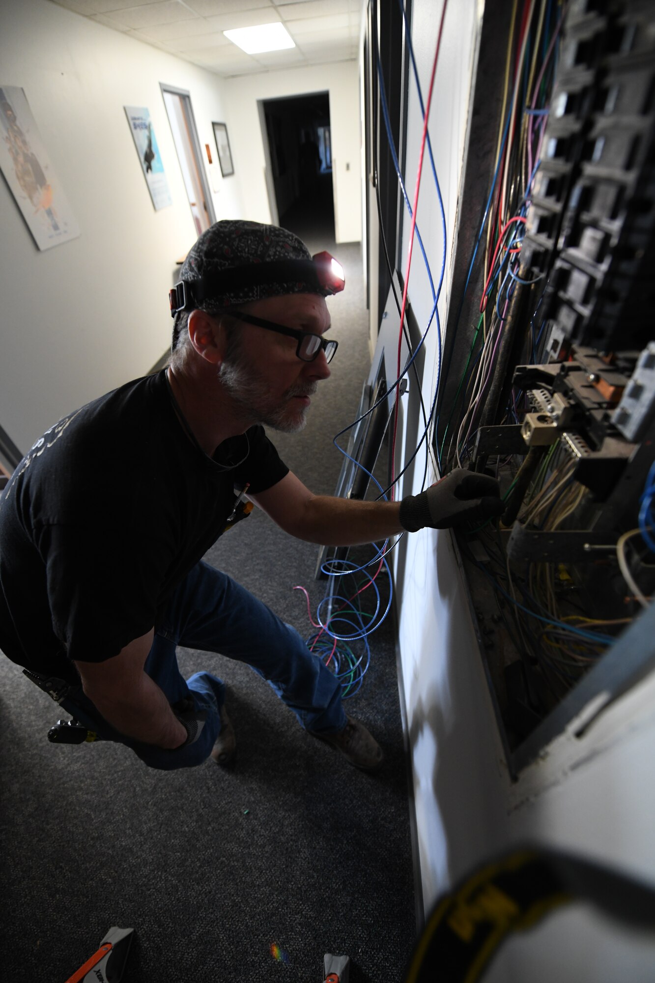 Civilian inspects wires