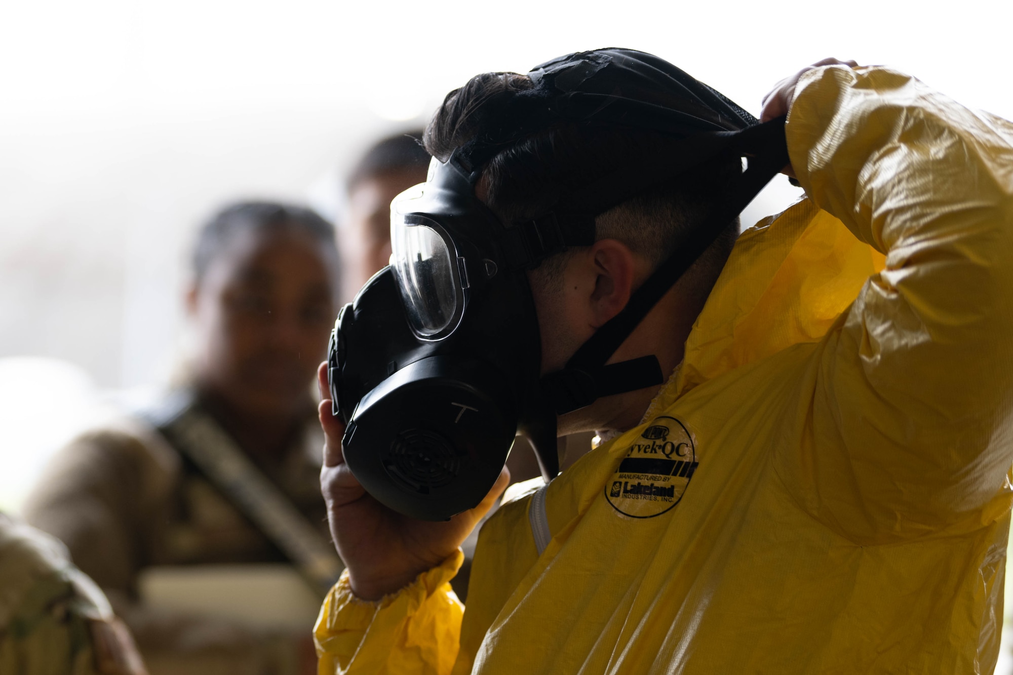 U.S. Air Force Staff Sgt. Michael Tobat, 480th Fighter Generation Squadron dedicated crew chief, dons a gas mask during exercise Radiant Falcon at Spangdahlem Air Base, Germany, April 24, 2024.