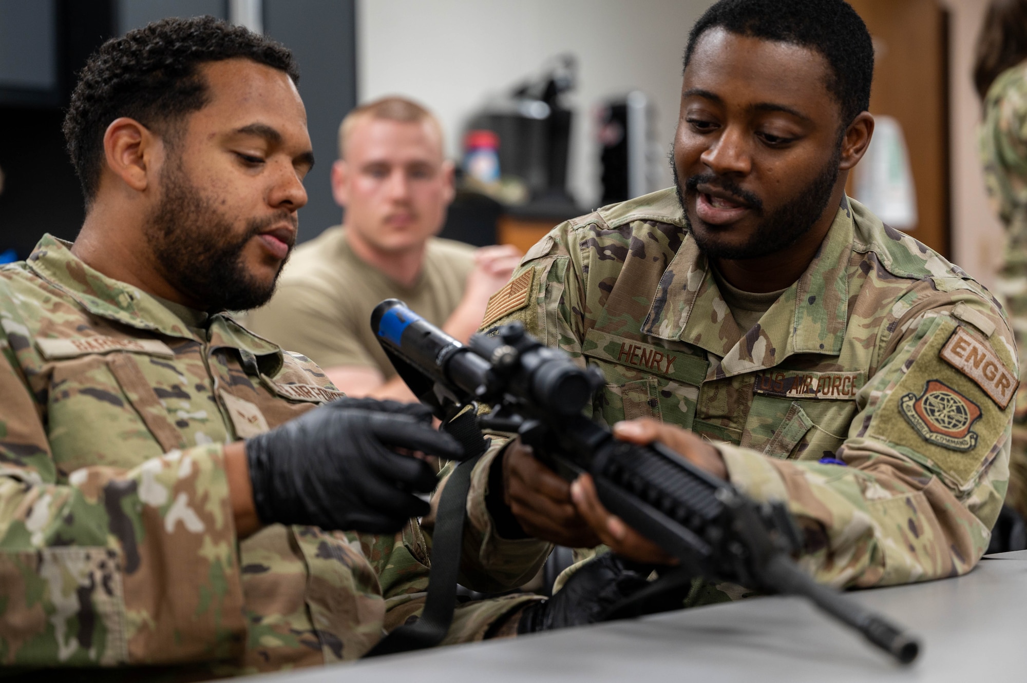 Airmen learn M4 weapon system specifics.