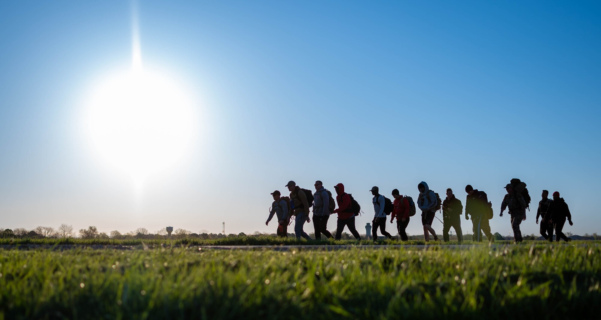 A group of Airmen participate in a ruck.