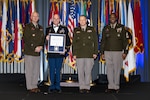 Staff Sgt. Lance Lauffer receiving a certificate of commendation at the Chief’s 54 awards ceremony March 14 in Houston. Also pictured are, left to right: Lt. Gen. Jon Jensen, director of the Army National Guard; Col. Andrew Bishop, chief of the Army National Guard Strength Management Division; and Sgt. Maj. Jabin Wade. Submitted photo