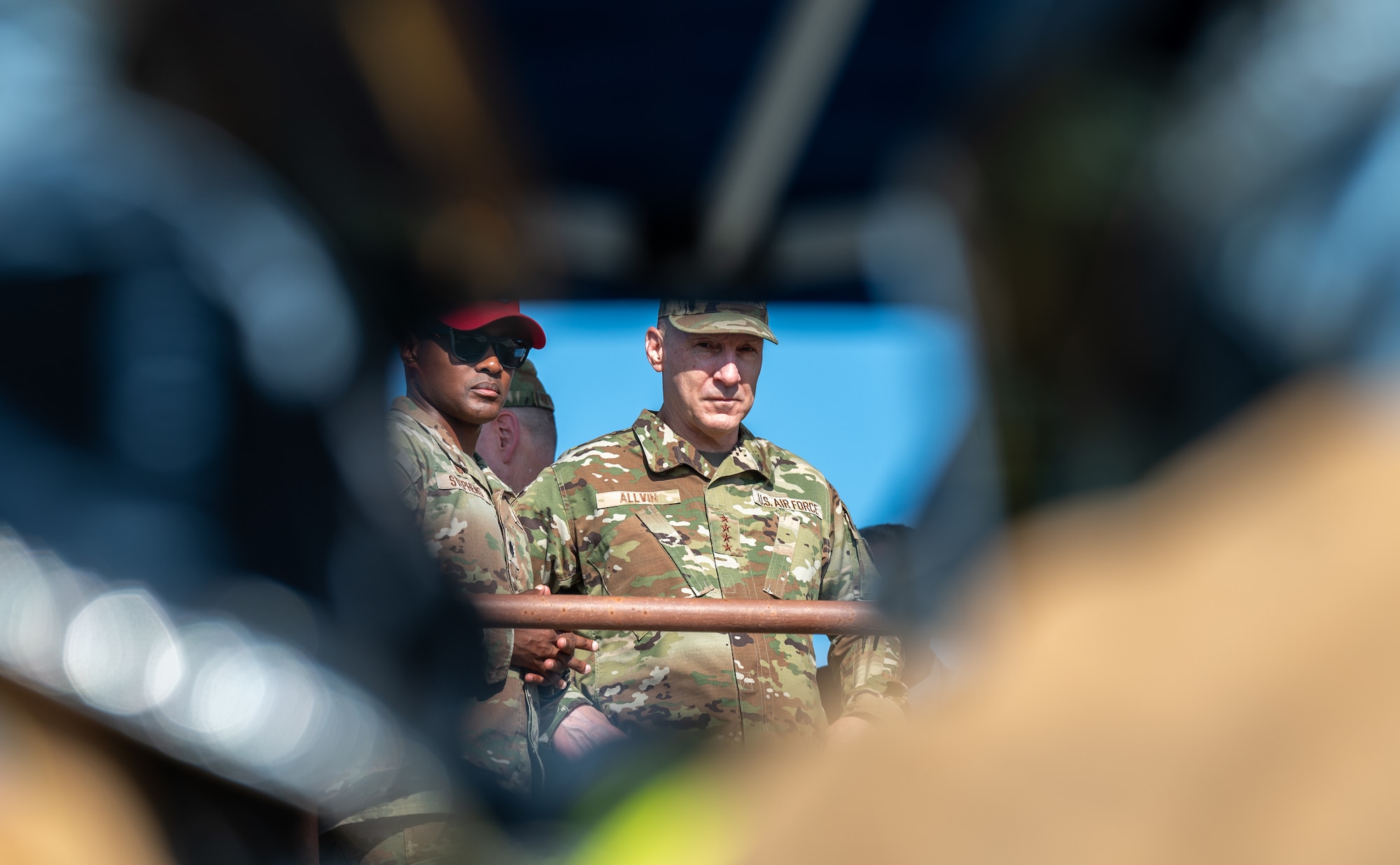 An airmen observes firefighters working