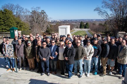 Members of the 1st Battalion 5th Infantry Regiment "Bobcats" meet for a 20th anniversary of their deployment to Mosul, Iraq during Operation Iraqi Freedom and commemorate the 19th anniversary of the passing of their colleague, Sgt. Stephen R. Sherman, who was killed in action by an improvised explosive device, on Feb. 3, at Arlington National Cemetery, in Arlington, Va. The Bobcats provided a wreath that was laid at the Tomb of the Unknown Soldier by Sherman’s mother who was accompanied by the Sentinels of the 3d U.S. Infantry Regiment – The Old Guard. After laying a wreath at the Tomb of the Unknown Soldier in Sherman’s honor, the Bobcats paid tribute to Sherman, and his surviving mother, by visiting his headstone and recalling stories of Sherman. Sherman’s mother closed the commemorative gathering by distributing coins dedicated to Sherman’s memory.