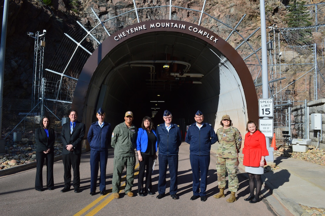 U.S. Navy Capt. Gervy Alota, Missile Warning Center commander, and German Air Force Brig. Gen. Volker Samanns, Ground Based Forces commander, stand with members from MWC, Headquarters U.S. Space Forces – Space and Joint Functional Component Command for Integrated Missile Defense, in front of the Cheyenne Mountain Complex, Colo., Apr. 23, 2024. Samanns visited the MWC to learn about the center’s mission. This visit enhances US-German missile defense cooperation through knowledge exchange on early warning and new technologies. S4S is responsible for planning and carrying out military space operations around the world. A critical operations center of S4S is the MWC, which works 24/7 to detect missile launches and nuclear detonations. (Courtesy Photo by the Missile Warning Center)