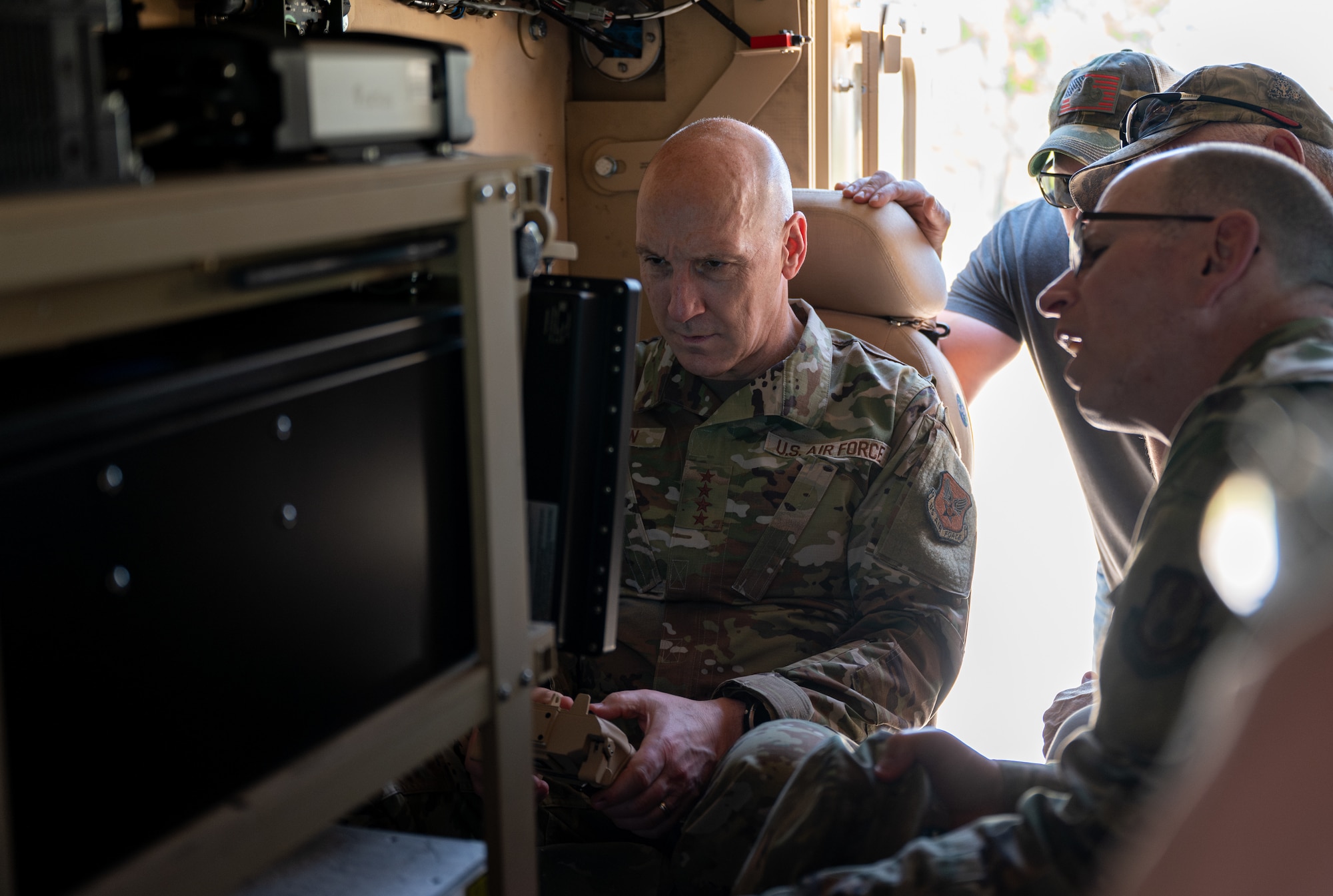 An airmen examines controls