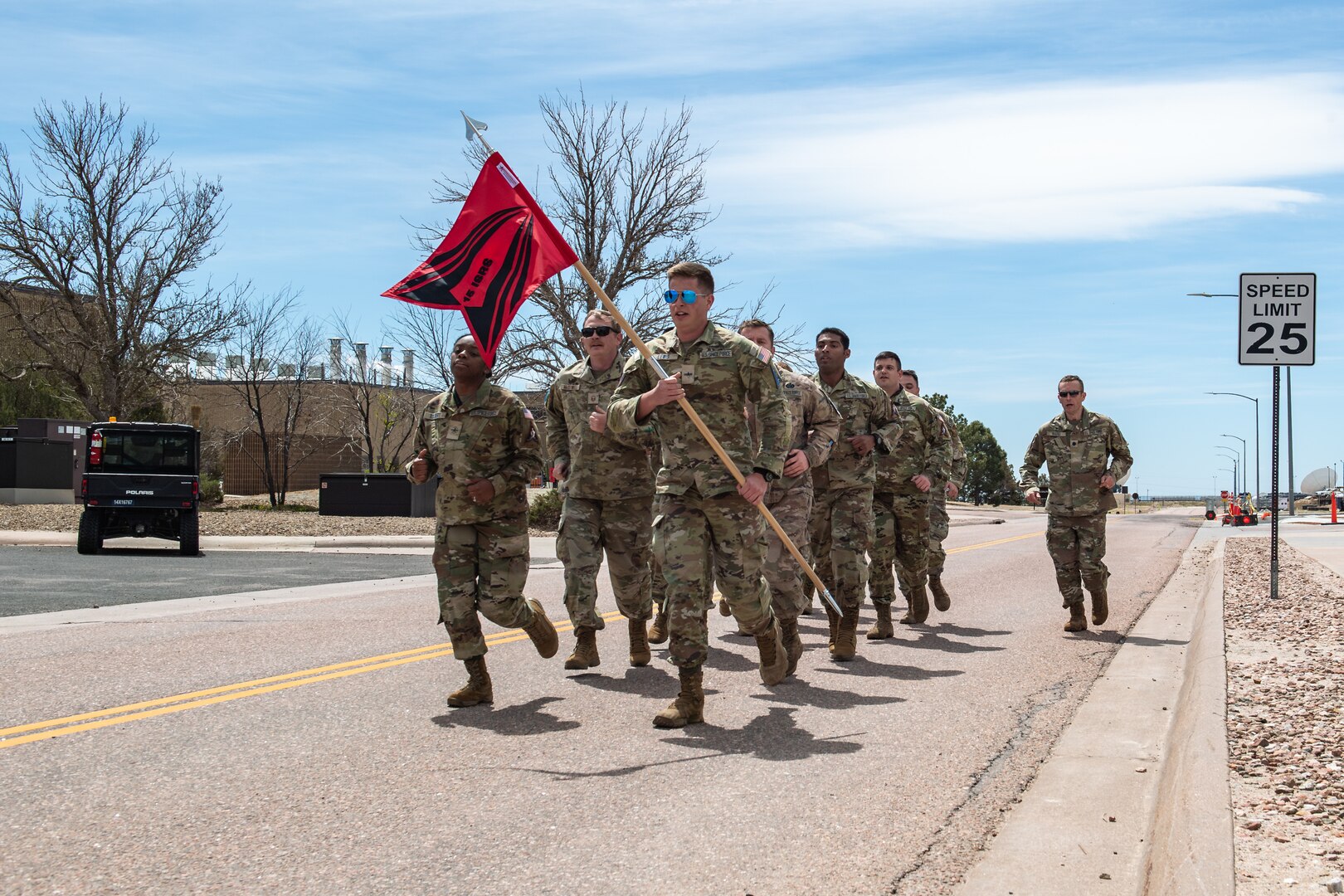 Military members running in formation