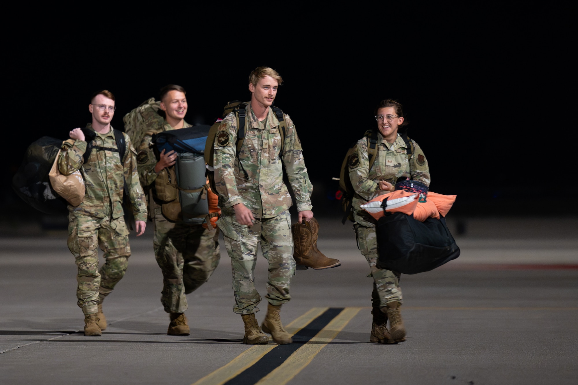 U.S. Air Force Airmen assigned to the 58th Rescue Squadron (RQS) approach family, friends and fellow Airmen after a six-month combat search and rescue deployment at Nellis Air Force Base, Nevada, April 9, 2024.