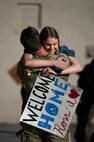 U.S. Air Force Capt. Ross Obenschain, assigned to the 58th Rescue Squadron (RQS), embraces his loved one as he returns home to Nellis Air Force Base, Nevada, April 9, 2024.