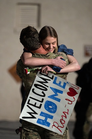 U.S. Air Force Capt. Ross Obenschain, assigned to the 58th Rescue Squadron (RQS), embraces his loved one as he returns home to Nellis Air Force Base, Nevada, April 9, 2024.