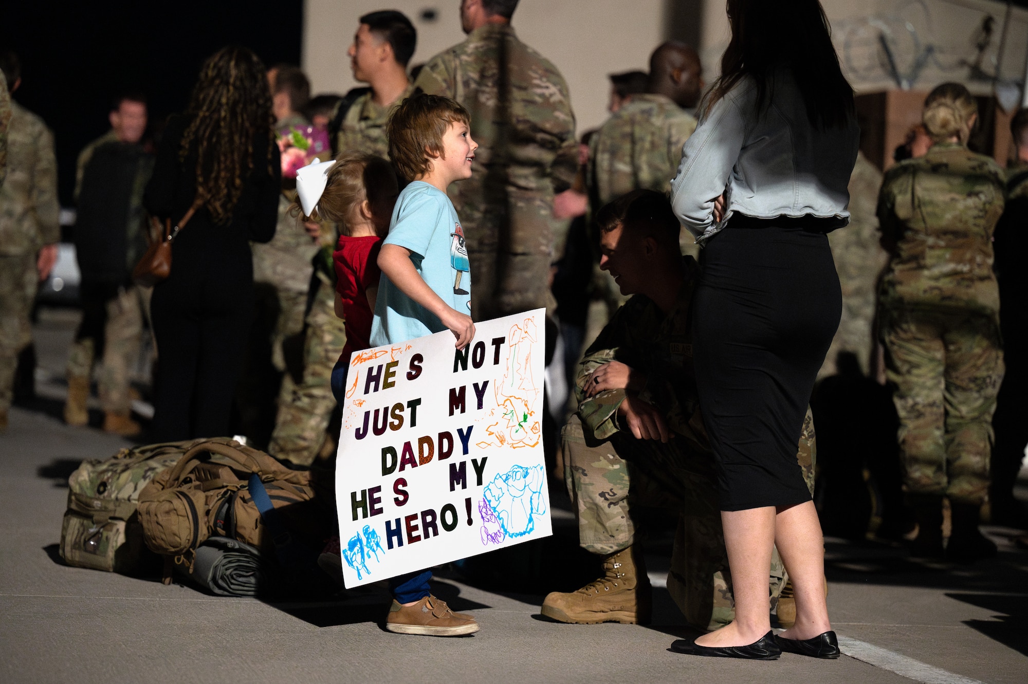 A military child greets his dad, assigned to the 58th Rescue Squadron (RQS), on the flight line at Nellis Air Force Base, Nevada, April 9, 2024.