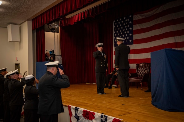 240419-N-KC192-2250 PORTSMOUTH, Va. (April 19, 2024) Naval Medical Forces Atlantic Command Master Chief Zachary Pryor, a native of Alliance, Nebraska, is given his final salute by his son Ensign Timothy Pryor during his retirement ceremony on board Naval Support Activity (NSA) Hampton Roads - Portsmouth Annex, April 19, 2024. Pryor served the Navy for nearly 32 years of dedicated service across 13 commands. (U.S. Navy photo by Mass Communication Specialist 2nd Class Levi Decker)