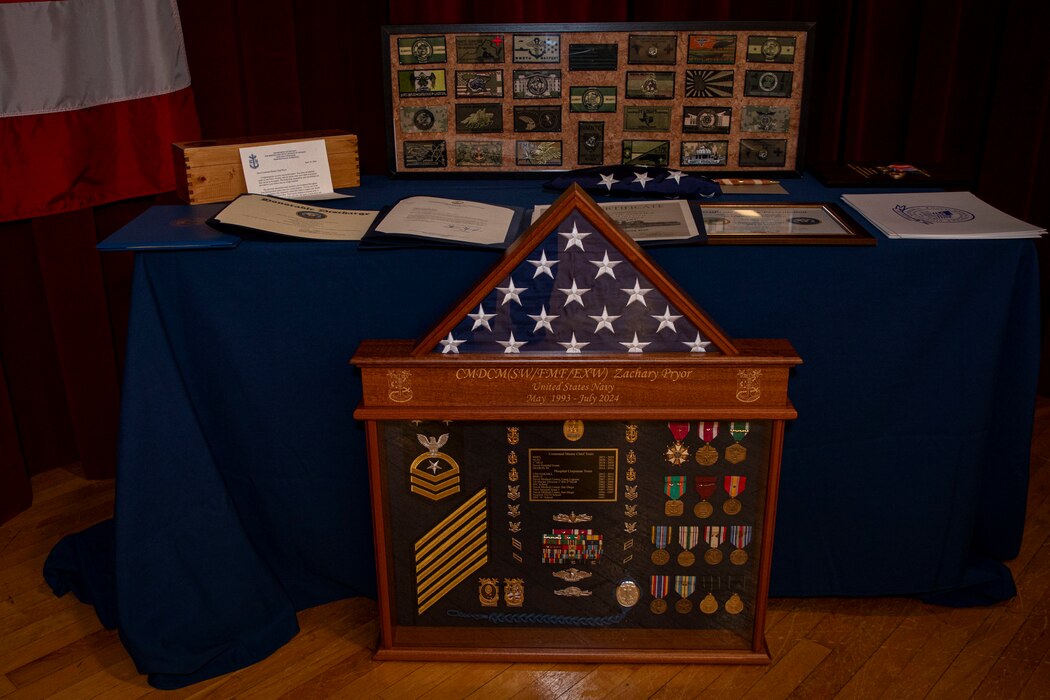 240419-N-KC192-2282 PORTSMOUTH, Va. (April 19, 2024) Awards and shadow box of Retired Naval Medical Forces Atlantic Command Master Chief Zachary Pryor, a native of Alliance, Nebraska, during his retirement ceremony on board Naval Support Activity (NSA) Hampton Roads - Portsmouth Annex, April 19, 2024. Pryor served the Navy for nearly 32 years of dedicated service across 13 commands. (U.S. Navy photo by Mass Communication Specialist 2nd Class Levi Decker)