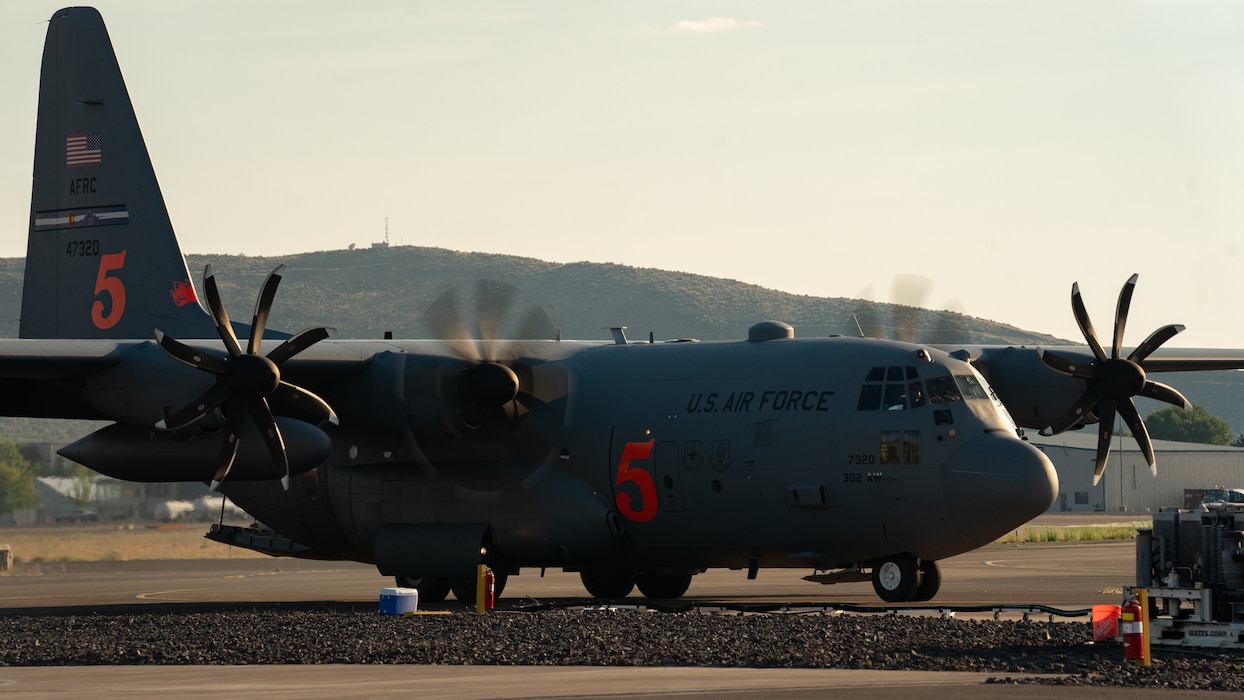 A U.S. Air Force Reserve Modular Airborne Fire Fighting System (MAFFS) equipped C-130H aircraft assigned to the 302nd Airlift Wing returns after performing wildfire suppression operations for the Wiley Fire with the U.S. Forest Service at the Klamath Falls Airtanker Base, Oregon, Aug. 8, 2023. U.S. Air Force C-130H MAFFS-equipped aircraft, as requested by the National Interagency Fire Center and approved by the Secretary of Defense, provide unique fire-fighting capabilities to support wildfire suppression efforts of the Wiley and Jerry Ridge Fires. Air Forces Northern, U.S. Northern Command’s Air Component Command, is the DoD’s operational lead for aerial military support to the National Interagency Fire Center, assisting with wildland fire suppression operations when requested. 