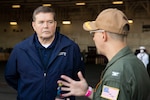 Raymond O'Toole Jr., then acting director of operational test and evaluation, speaks with Capt. Paul Lanzilotta, commanding officer of the USS Gerald R. Ford, during a visit to the ship, May 19, 2021. O'Toole was conducting a visual assessment of the ship's readiness for Full Ship Shock Trials.