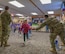 Students are welcomed to school by Team Minot Airmen and families during a clap-in at North Plains Elementary School, Minot Air Force Base, North Dakota, April 26, 2024. Each April, Team Minot celebrates the Month of the Military Child and holds events to honor military children. (U.S. Air Force photo by Airman 1st Class Kyle Wilson)
