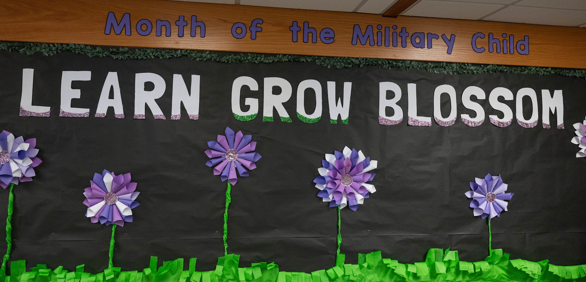 A sign for the Month of the Military Child is displayed at North Plains Elementary School, Minot Air Force Base, North Dakota, April 26, 2024. Each year during the month of April, the Department of Defense joins national, state, and local government, schools, military serving organizations, companies and private citizens in celebrating military children and the sacrifices they make. (U.S. Air Force photo by Airman 1st Class Kyle Wilson)