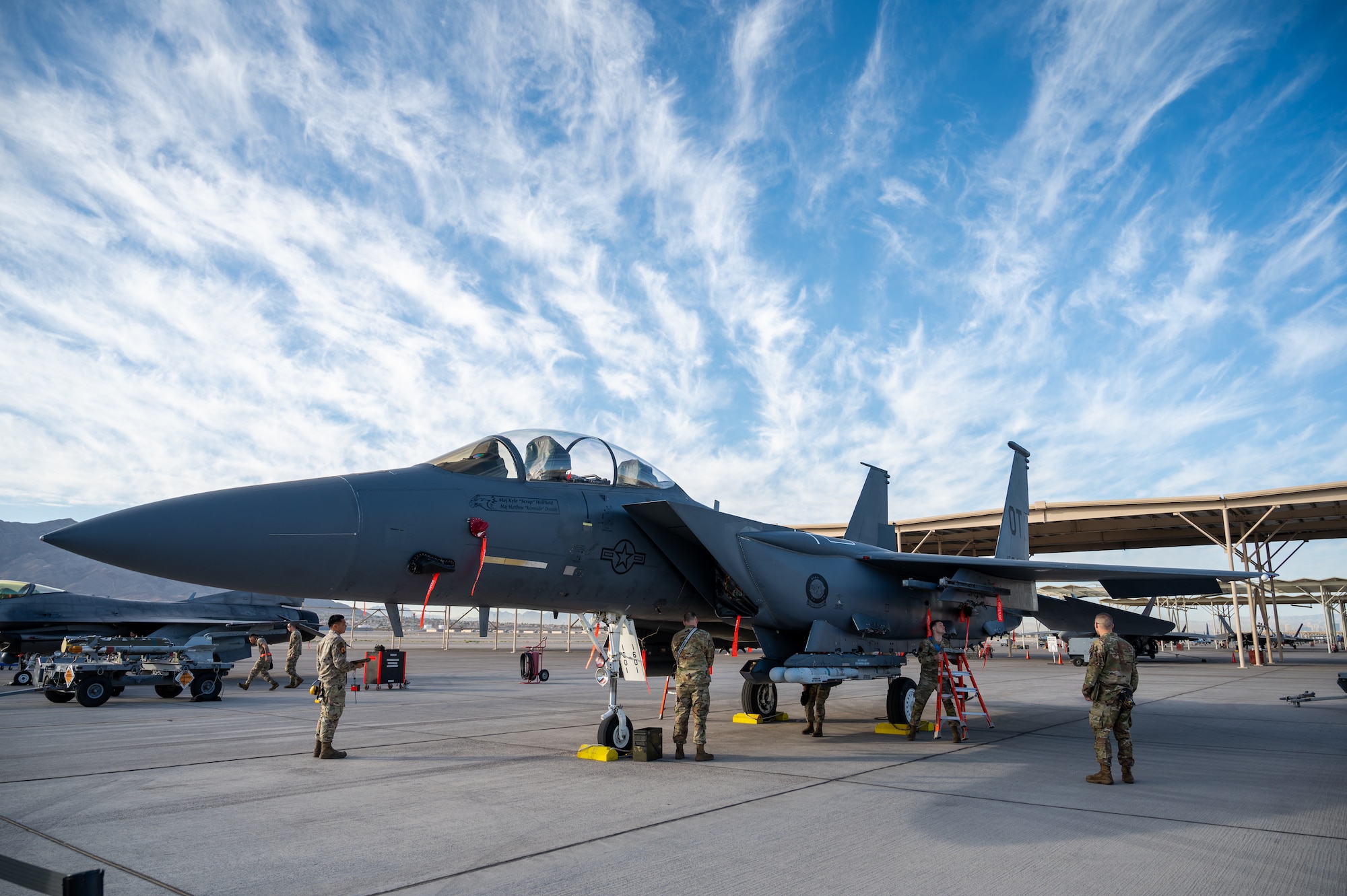 U.S. Air Force Airmen assigned to the 757th Aircraft Maintenance Squadron Strike Aircraft Maintenance Unit participate in a load crew of the first quarter competition with an F-15E Strike Eagle at Nellis Air Force Base, Nevada, April 12, 2024.