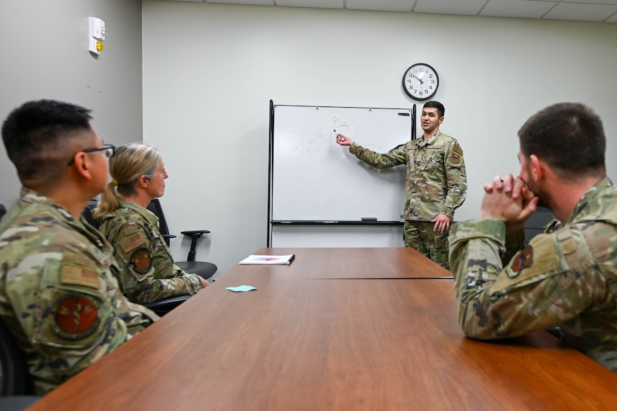 Senior Airman Cameron Fletcher-Cantu, 59th Medical Operations Squadron mental health technician, demonstrates a staged group therapy session in the Mental Health Clinic at Wilford Hall Ambulatory Surgical Center, Joint Base San Antonio-Lackland, Texas, April 23, 2024. In efforts to promote sexual assault awareness and prevention: speak out if witnessing harassment, utilize the various counseling options available to survivors, and be informed of the two available – Unrestricted and Restricted – reporting options. Unrestricted Reports enable adult victims of sexual assault to report crimes without requesting confidentiality for their allegations, while Restricted Reports allow adult victims of sexual assault to confidentially report the crime to specified individuals without initiating an investigation. (Air Force photo by Senior Airman Melody Bordeaux)