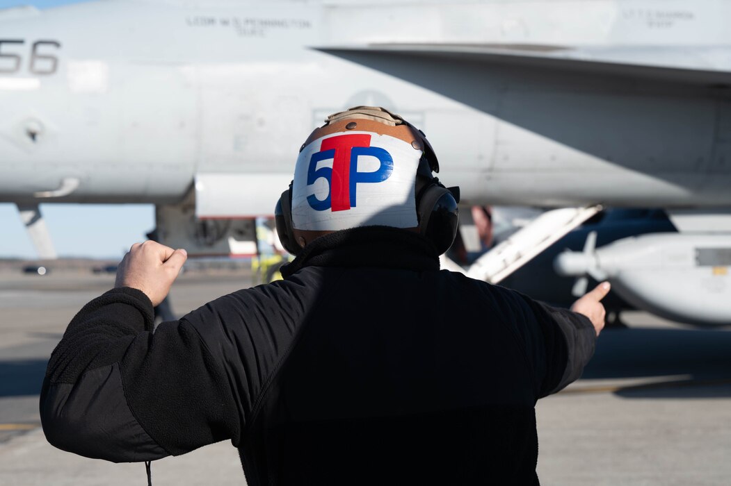 U.S. Navy Aviation Electronics Technician runs through pre-flight checks during Red Flag-Alaska 24-1.