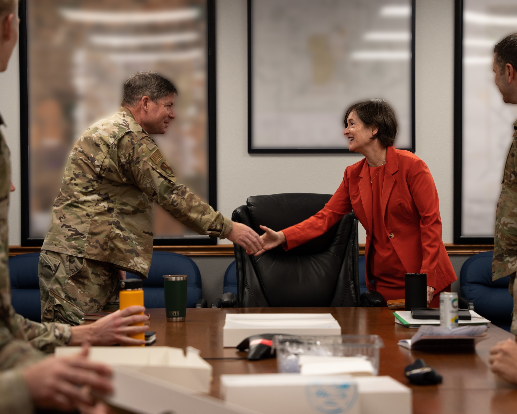 U.S. Air Force Col. Barry Roche, 27th Special Operations Mission Support Group commander, greets Susan Veazey, Regional Director of the Department of Defense’s Office of Local Defense Community Cooperation, for a meeting with the 27th SOMSG leadership at Cannon Air Force Base, N.M., April 24, 2024. OLDCC, in coordination with other federal agencies, delivers a program that enables states, local governments, and communities to increase military, civilian, and industrial readiness and resiliency, and support military families. (U.S. Air Force photo by Senior Airman Parra)