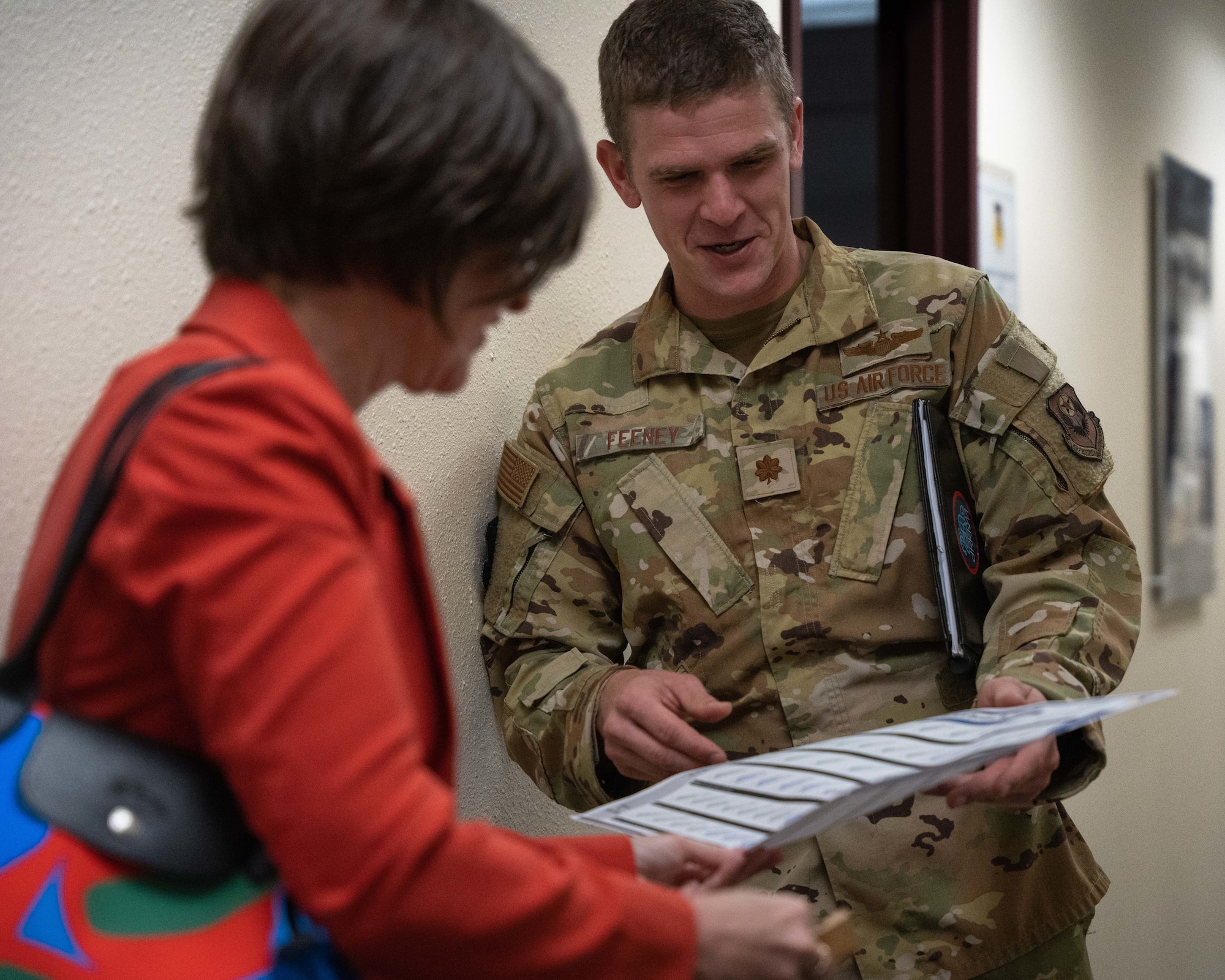 U.S. Air Force Maj. Riley Feeney, 27th Special Operations Wing commander’s action group director, presents the 27 SOW lines of effort placemat to Susan Veazey, Regional Director of the Defense’s Office of Local Defense Community Cooperation, at Cannon Air Force Base, N.M., April 24, 2024. OLDCC, in coordination with other federal agencies, delivers a program that enables states, local governments, and communities to cooperate with their military installations and leverage public and private capabilities and deliver public infrastructure and services to enhance the military mission, achieve savings, and reduce operating cost. (U.S. Air Force photo by Senior Airman Parra)