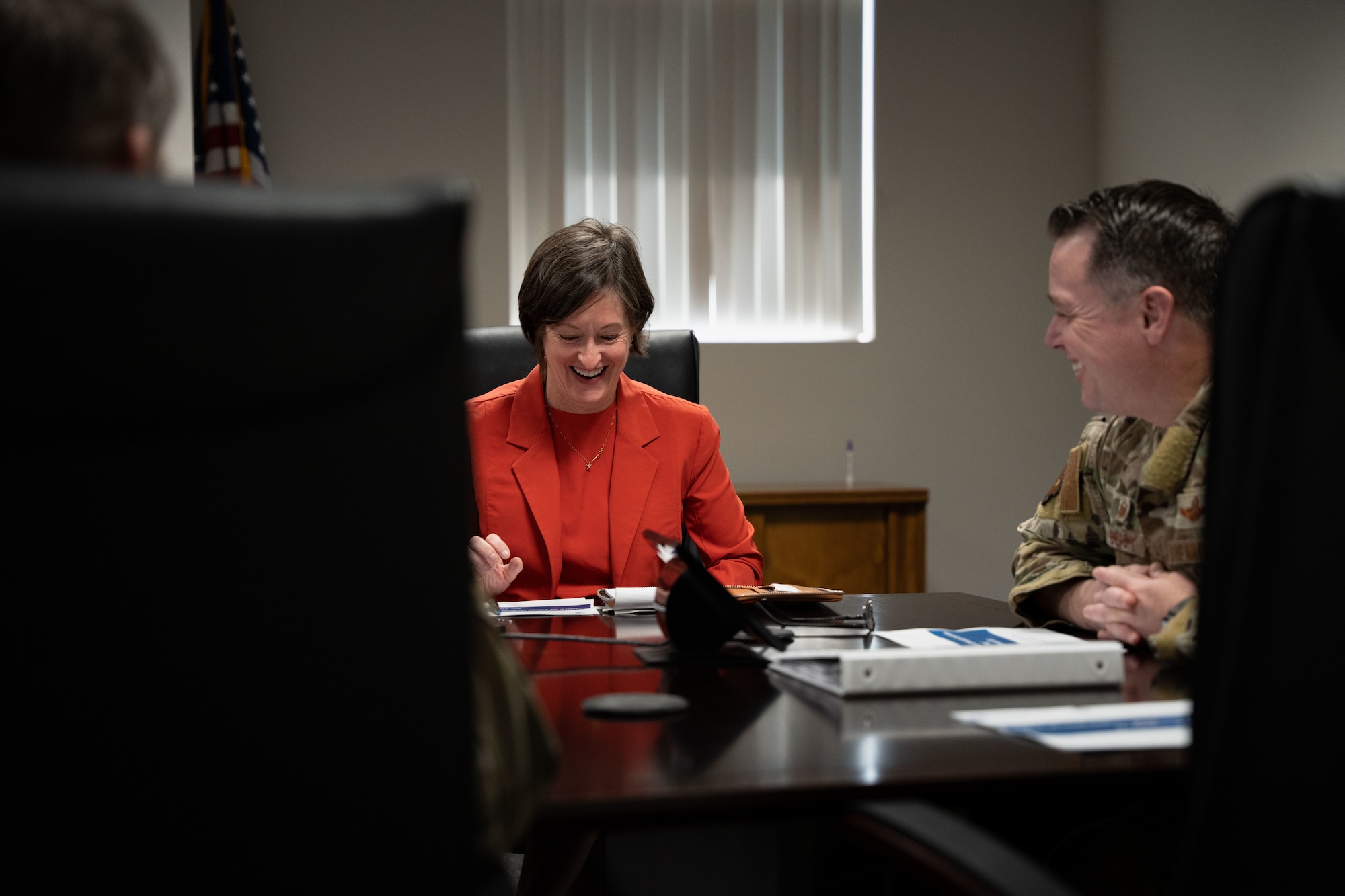 Susan Veazey, Regional Director of the Department of Defense’s Office of Local Defense Community Cooperation, speaks with U.S. Air Force Col. Jeremy S. Bergin, 27th Special Operations Wing commander, during the 27 SOW leadership meeting at Cannon Air Force Base, N.M., April 24, 2024. OLDCC provides grant funding that enhances installation resilience while also enabling civilian responses to local impacts to state and local governments to help communities support the military mission. (U.S. Air Force photo by Senior Airman Parra)