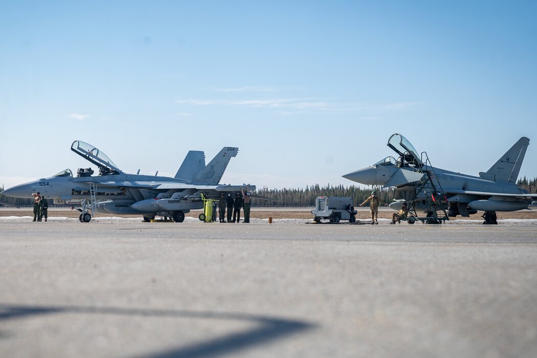 U.S. Navy and Italian Air Force service members prepare for familiarization flights during Red Flag-Alaska 24-1.
