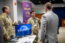 United States Space Force Capt. Jeremy Swaw, Spark Leader, and USSF Capt. Andrew Ermitano, SpaceWERX Venture, speak to attendees about the SpaceWERX program during the 2024 Cyber Expo at Los Angeles Air Force Base in El Segundo, Calif. As the innovation arm of the USSF and a unique division within AFWERX, SpaceWERX inspires and empowers collaboration with innovators to accelerate capabilities and shape the future in space.